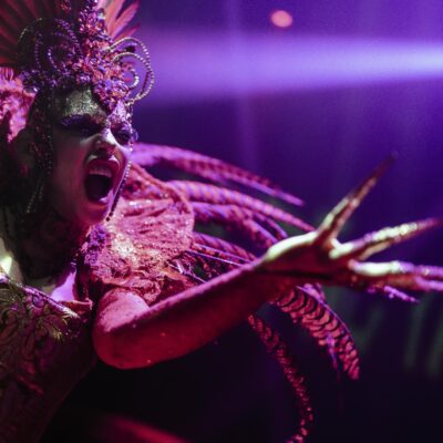 Performer in Club Chinois wearing colourful costume